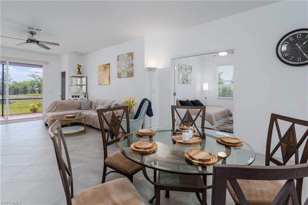 2140 Dragonfruit Way Naples, FL 34120 - Photo 11 of 35 a view of a dining room with furniture and a table