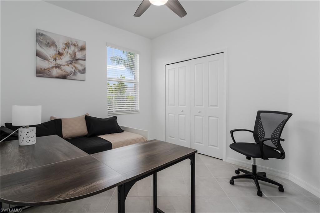 2140 Dragonfruit Way Naples, FL 34120 - Photo 22 of 35 a living room with furniture and a window