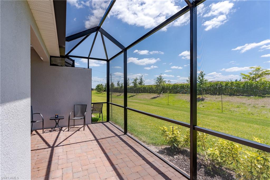 2140 Dragonfruit Way Naples, FL 34120 - Photo 27 of 35 a view of lake from a balcony