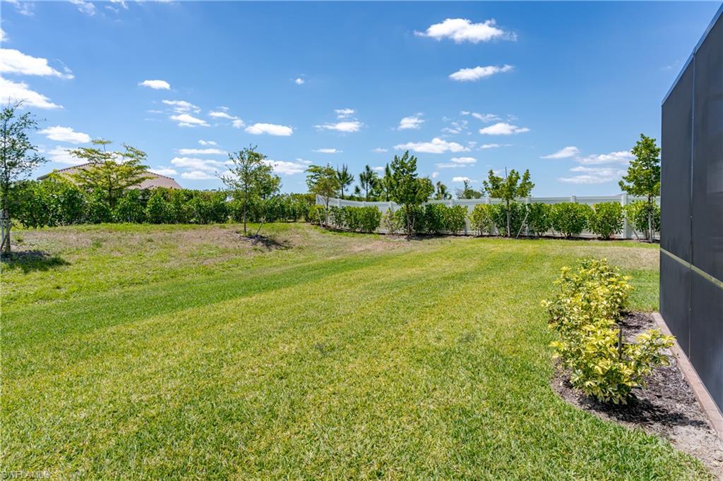 2140 Dragonfruit Way Naples, FL 34120 - Photo 35 of 35 a view of an outdoor space and basketball court