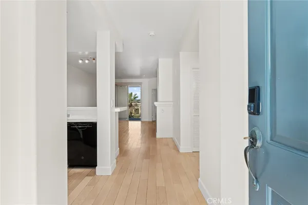 a view of a hallway view with wooden floor and staircase