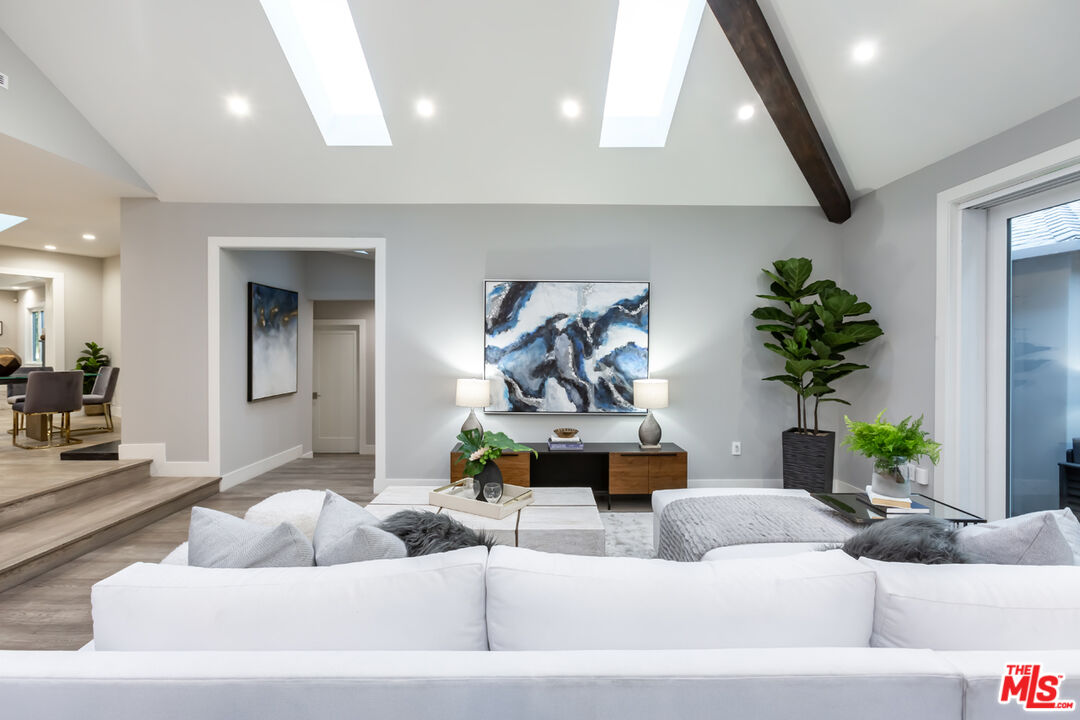 10700 Lindbrook Drive Los Angeles, CA 90024 - Photo 13 of 42 a living room with furniture and a potted plant