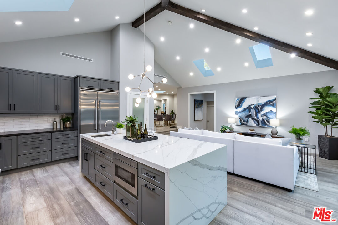 10700 Lindbrook Drive Los Angeles, CA 90024 - Photo 17 of 42 a kitchen with sink stove and cabinets