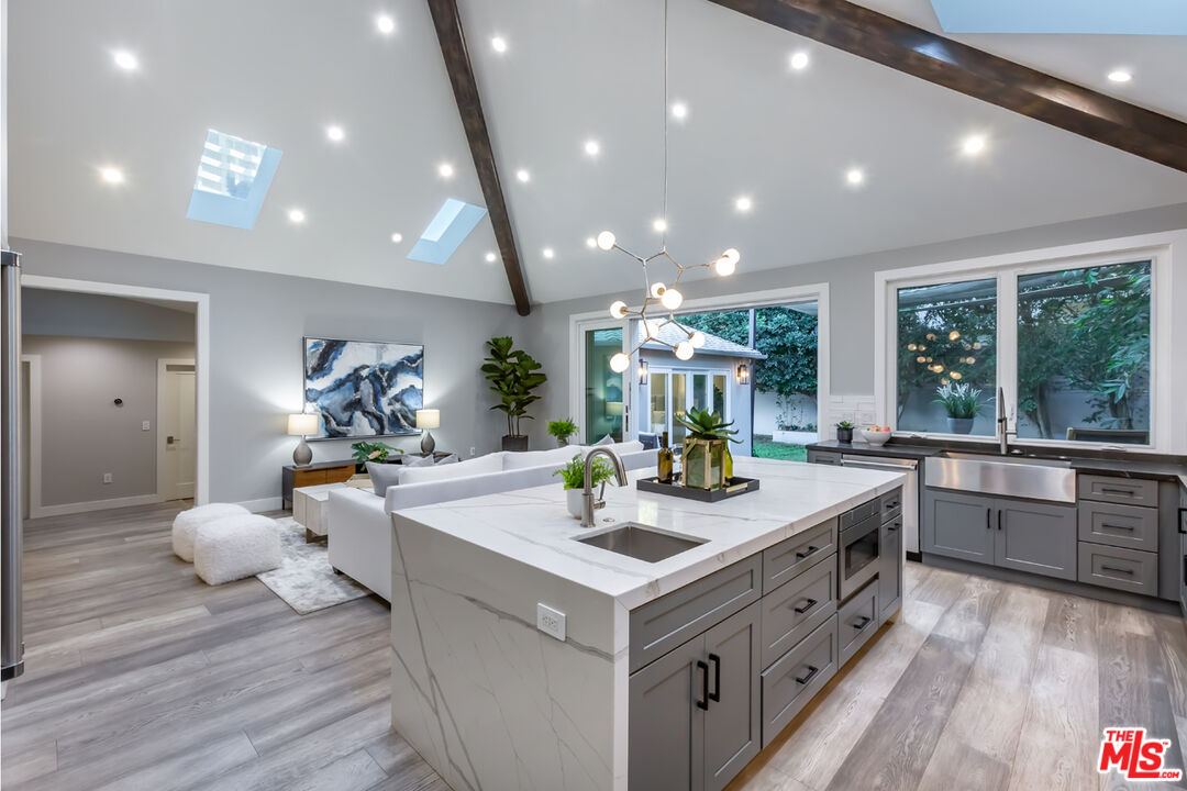 10700 Lindbrook Drive Los Angeles, CA 90024 - Photo 18 of 42 a view of living room with granite countertop furniture and a large window