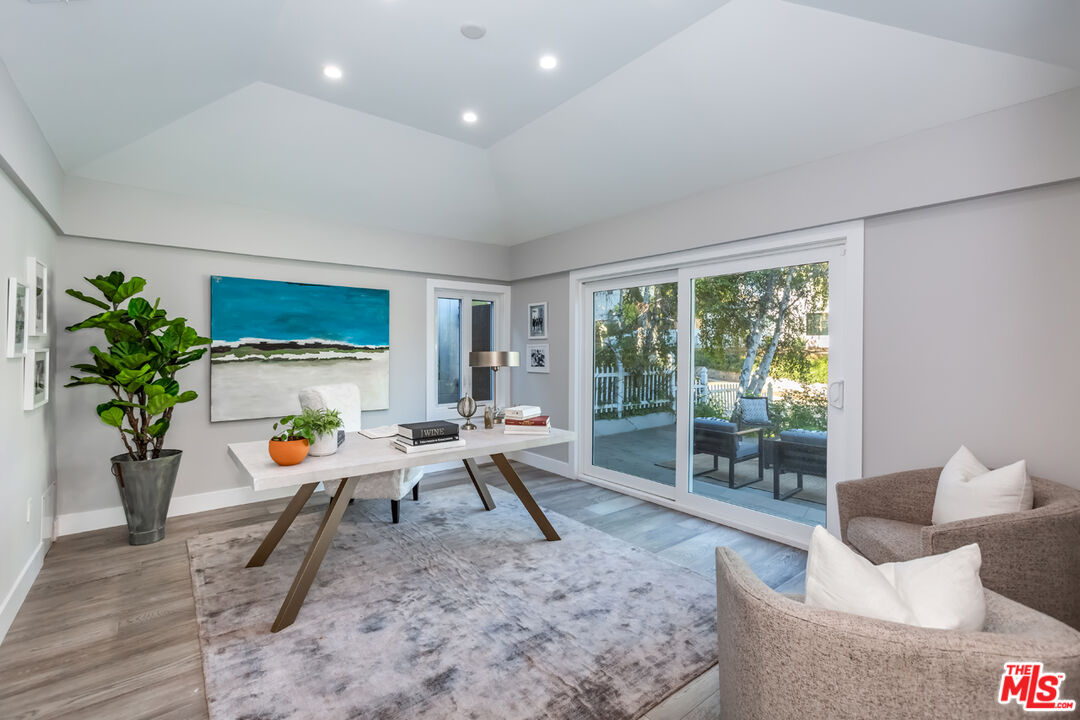 10700 Lindbrook Drive Los Angeles, CA 90024 - Photo 32 of 42 a living room with furniture and floor to ceiling window