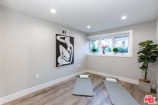 10700 Lindbrook Drive Los Angeles, CA 90024 - Photo 35 of 42 a room with a window and potted plant