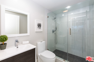 10700 Lindbrook Drive Los Angeles, CA 90024 - Photo 36 of 42 a bathroom with a sink a toilet and shower