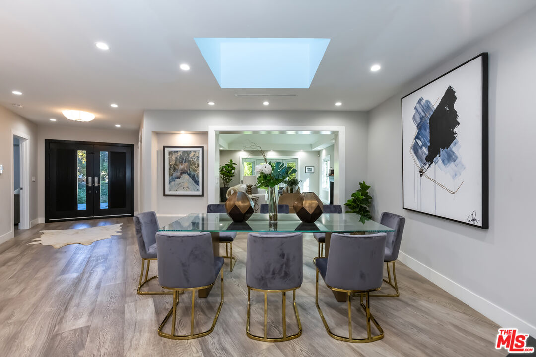 10700 Lindbrook Drive Los Angeles, CA 90024 - Photo 7 of 42 a view of a dining room with furniture window and wooden floor