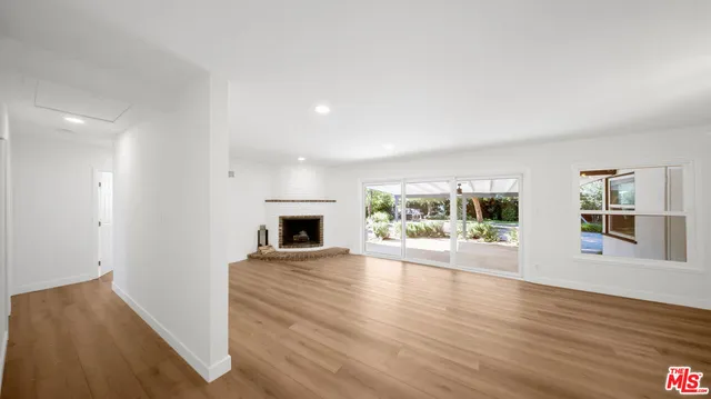 a view of livingroom with furniture window and wooden floor