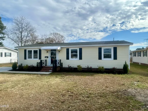 a view of a house with a yard