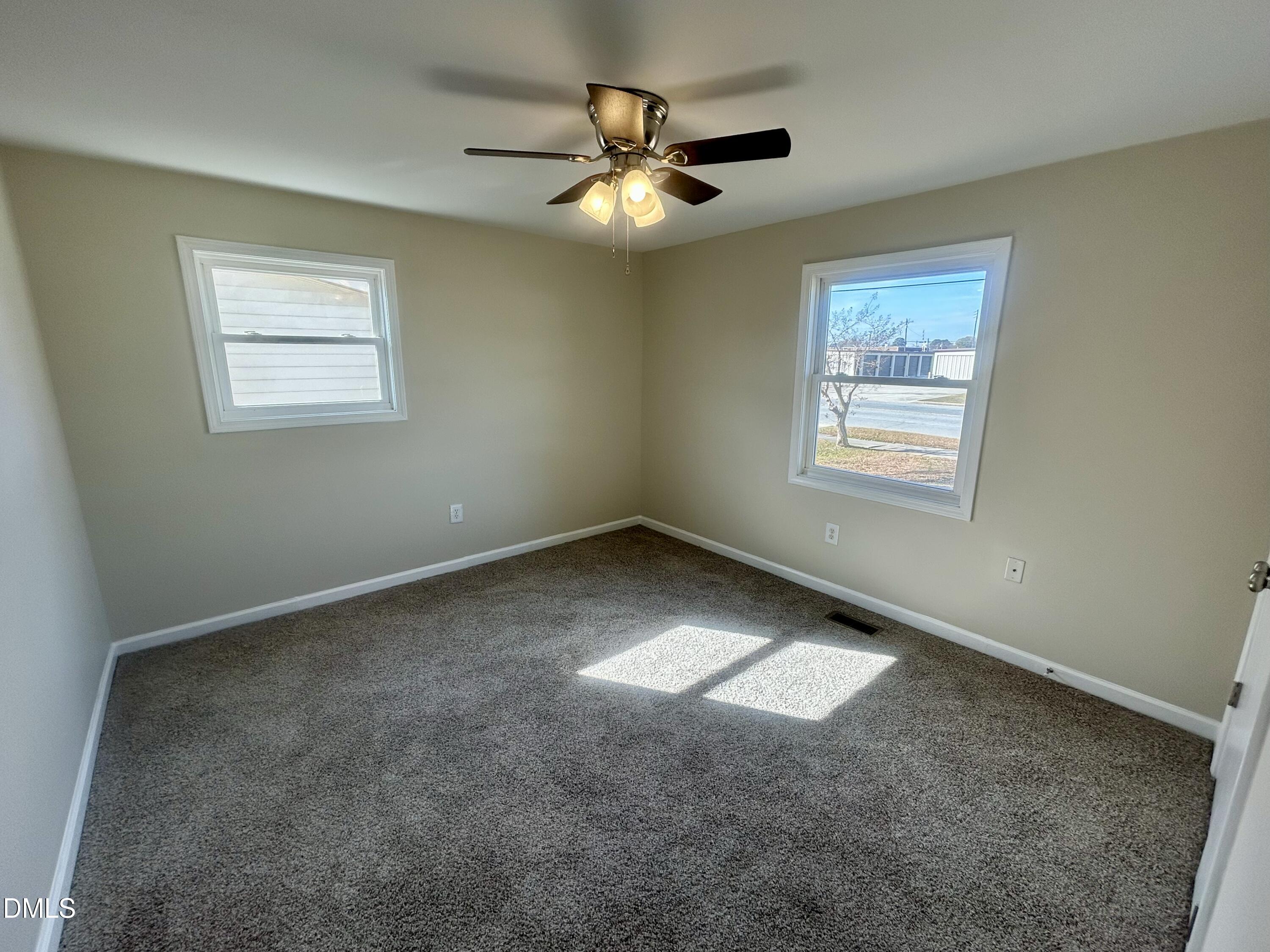 403 South Market Street Benson, NC 27504 - Photo 14 of 18 a view of an empty room with a window
