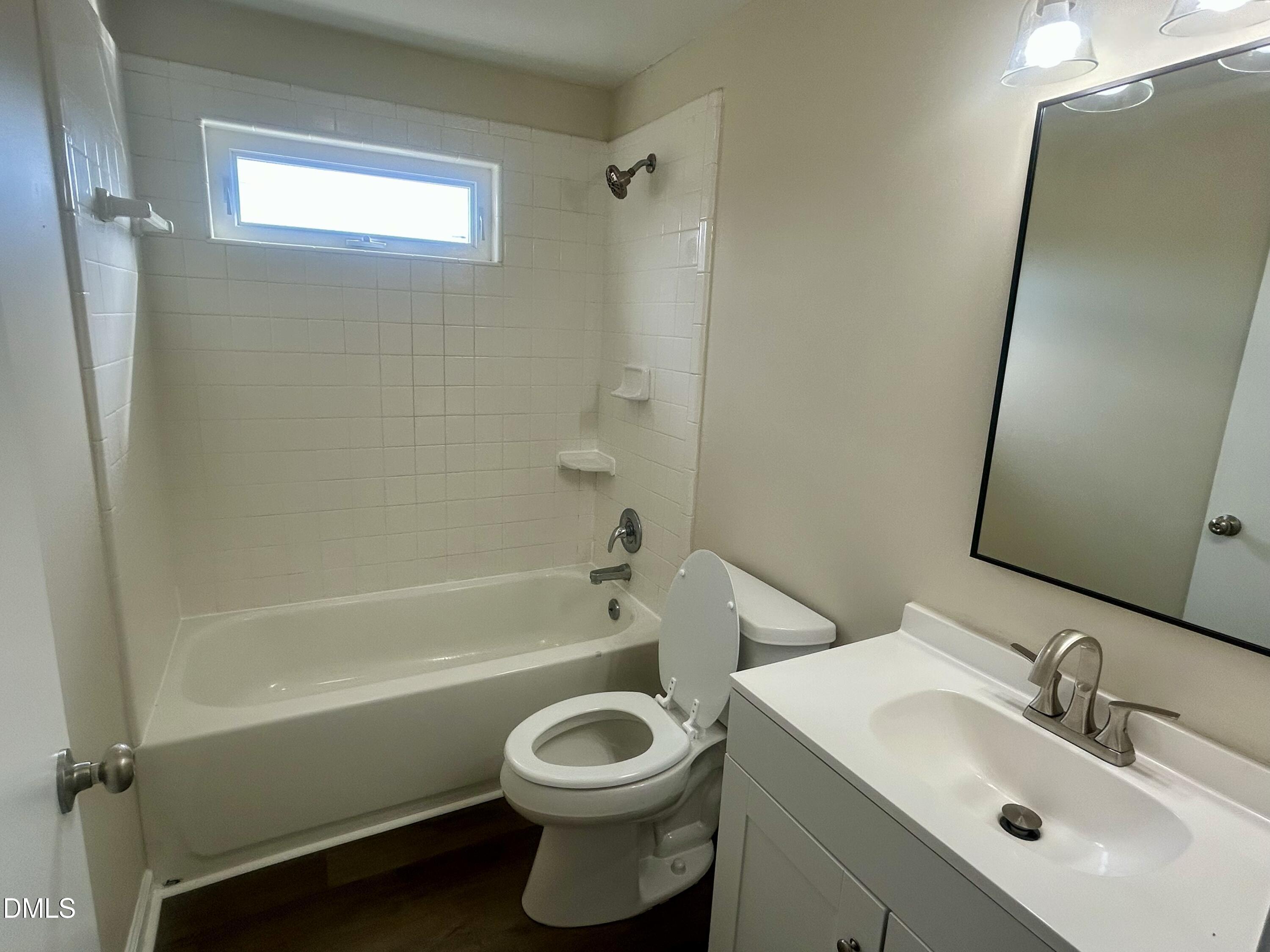 403 South Market Street Benson, NC 27504 - Photo 9 of 18 a bathroom with a sink toilet and shower