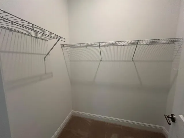 a view of a room with racks on the wall