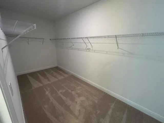 a view of a room with racks on the wall