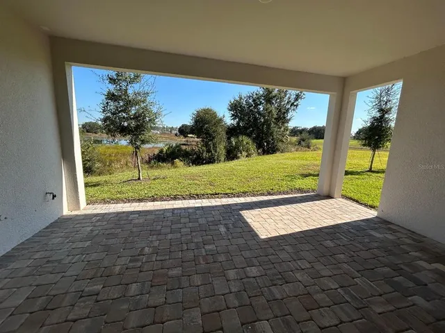 a view of a porch and a yard