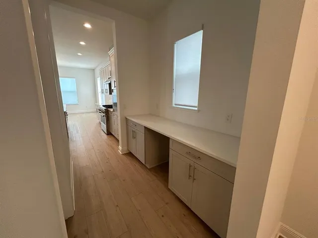 a bathroom with a sink a mirror and a toilet