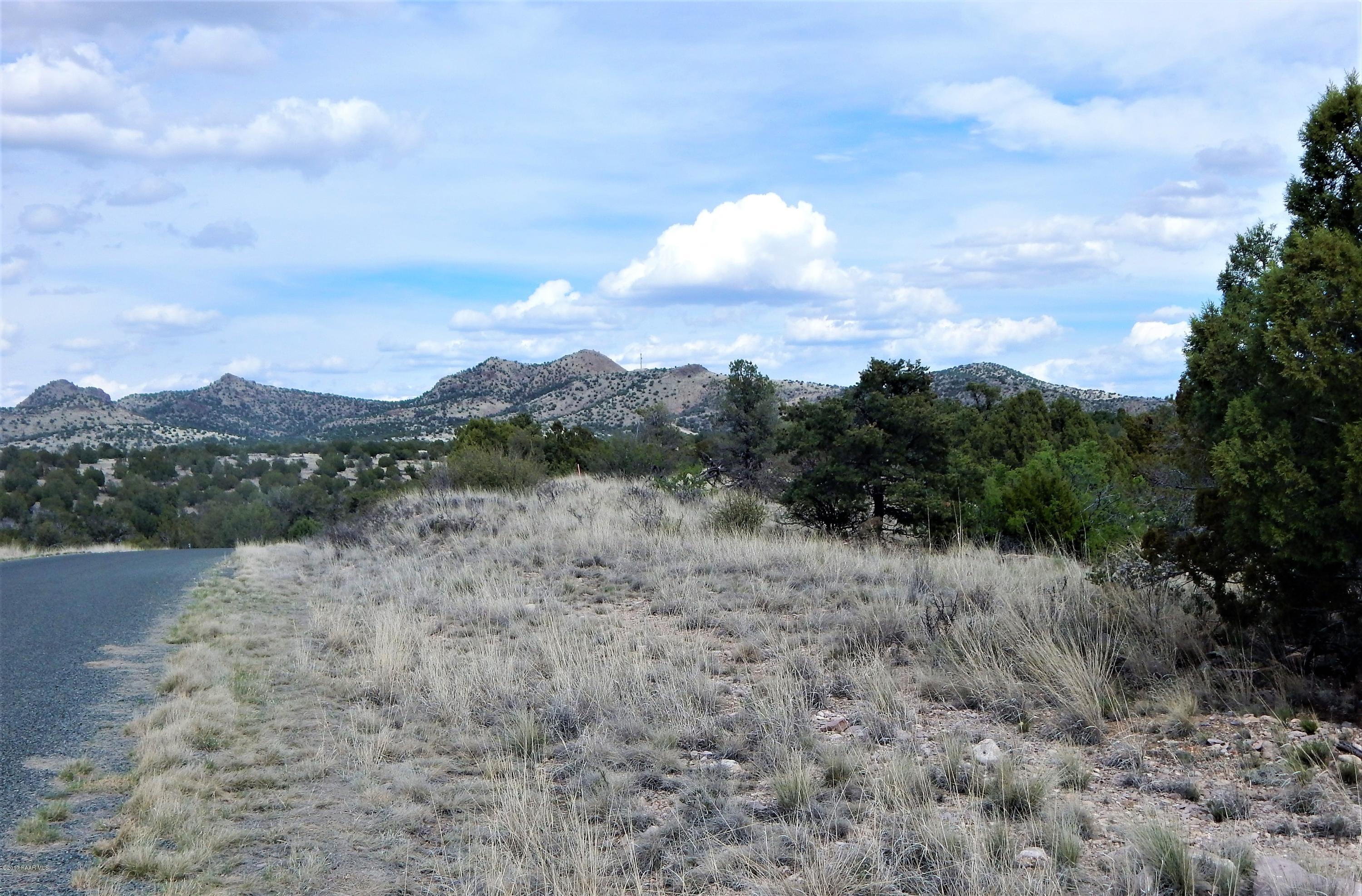 18201 Crossroads Ranch Road Prescott, AZ 86305 - Photo 4 of 14 a view of a lake with mountains in the background