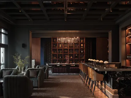 a living room with furniture a dining table and chairs