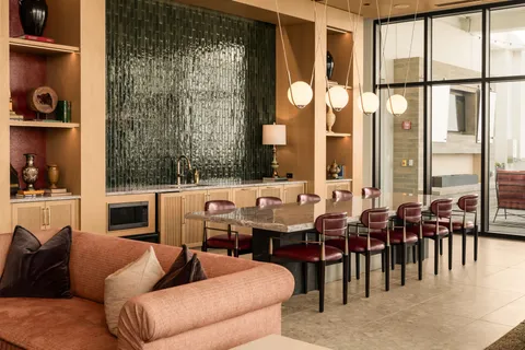 a dining area with furniture and window