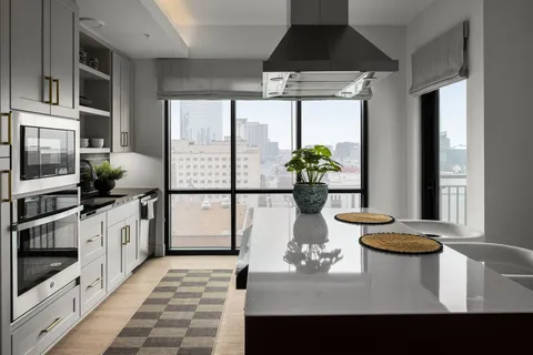 a kitchen with a sink stove and microwave