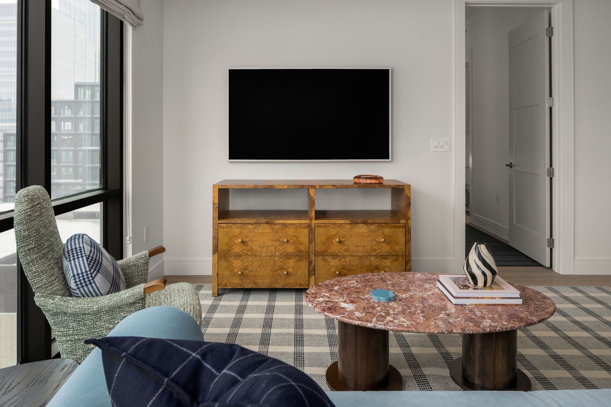 930 Commerce Street, Unit 9 Nashville, TN 37203 - Photo 6 of 40 a living room with furniture and a flat screen tv