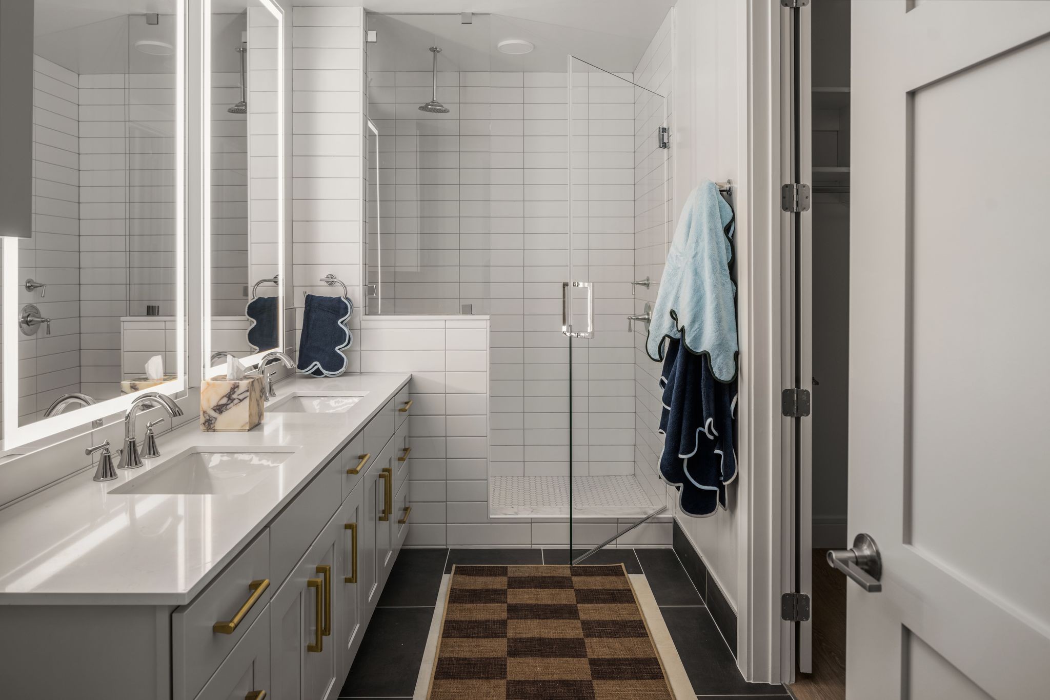 930 Commerce Street, Unit 9 Nashville, TN 37203 - Photo 9 of 40 a bathroom with a sink and a mirror