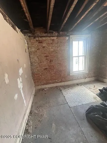 a view of two couches in a room