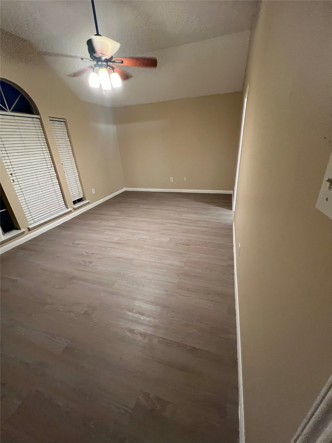 4018 Longway Estates Court Fresno, TX 77545 - Photo 12 of 20 wooden floor in an empty room with a mirror