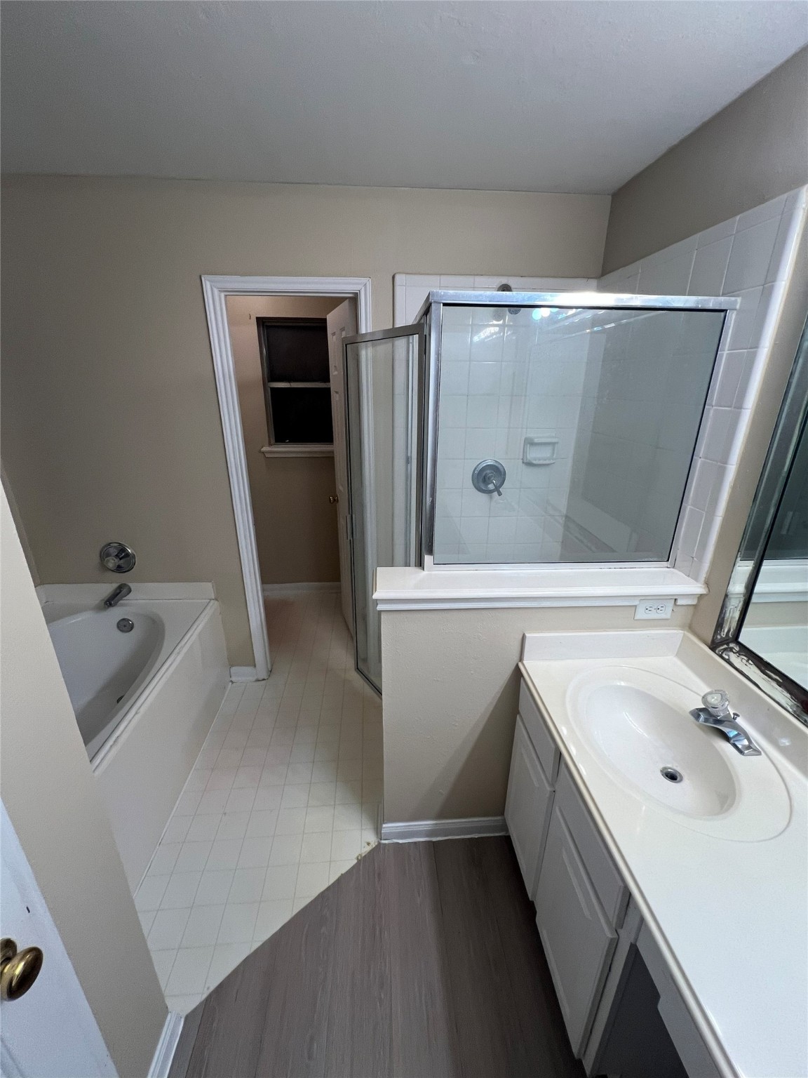 4018 Longway Estates Court Fresno, TX 77545 - Photo 15 of 20 a bathroom with a sink and mirror with bathtub