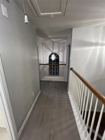 a view of a hallway view with staircase