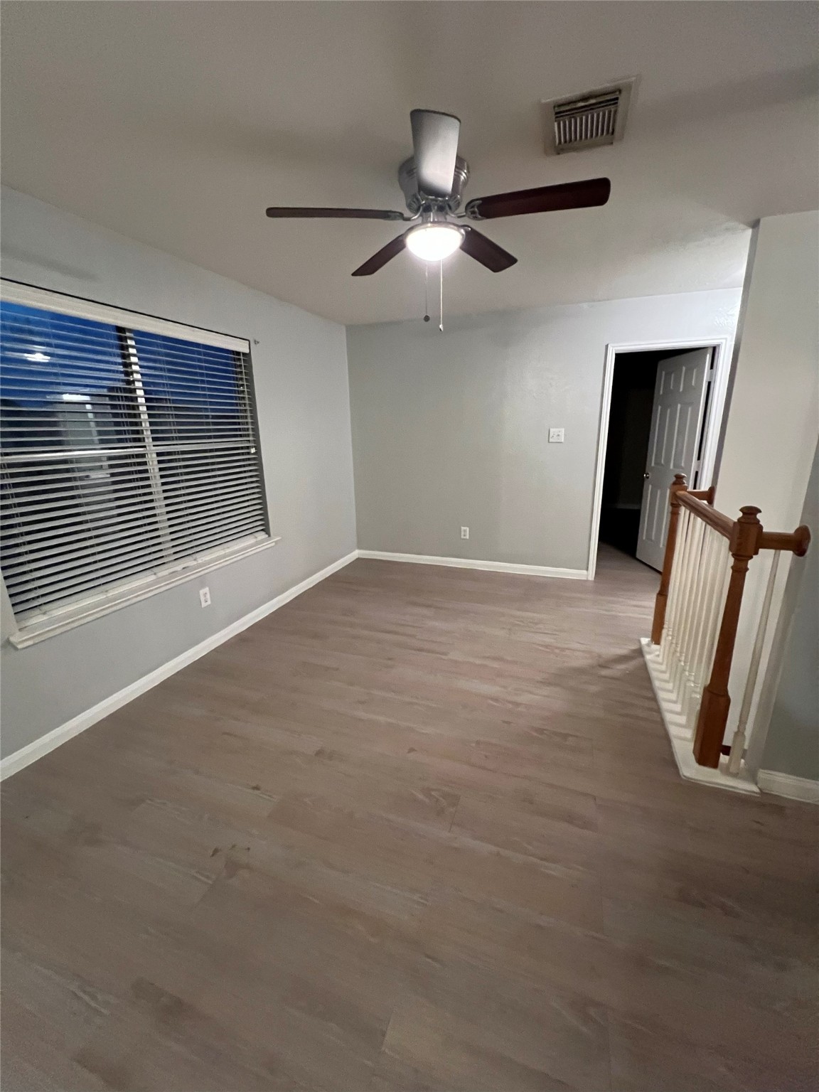 4018 Longway Estates Court Fresno, TX 77545 - Photo 10 of 20 a view of an empty room with wooden floor and a window