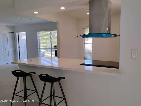 a kitchen with stainless steel appliances a refrigerator and a stove
