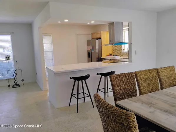 a view of kitchen and dining room with furniture