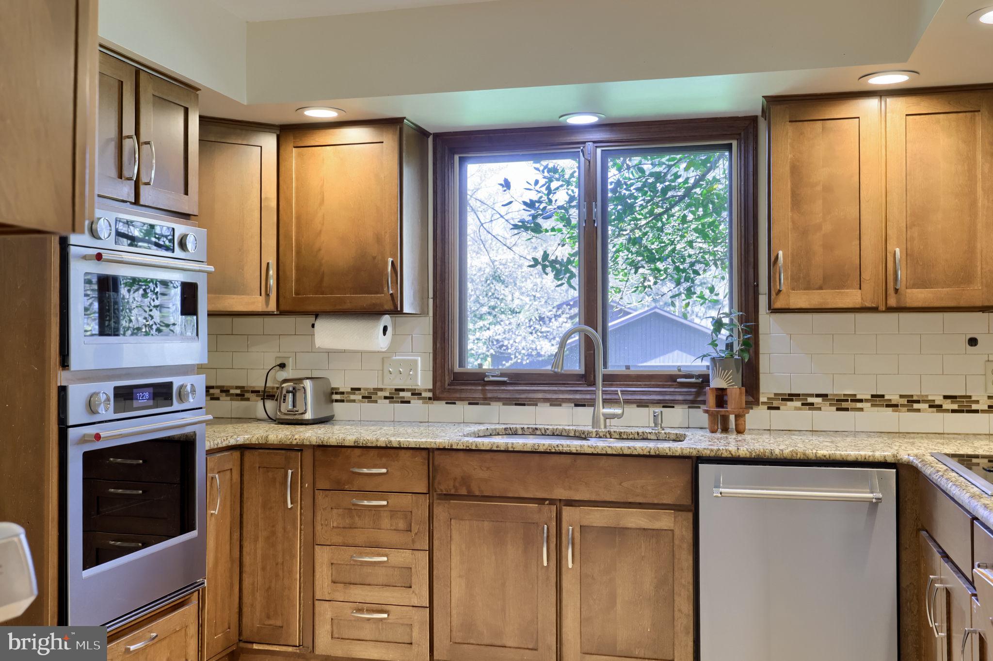 2211 Rocky Ridge Court York, PA 17406 - Photo 13 of 48 a kitchen with stainless steel appliances granite countertop a sink a stove and cabinets
