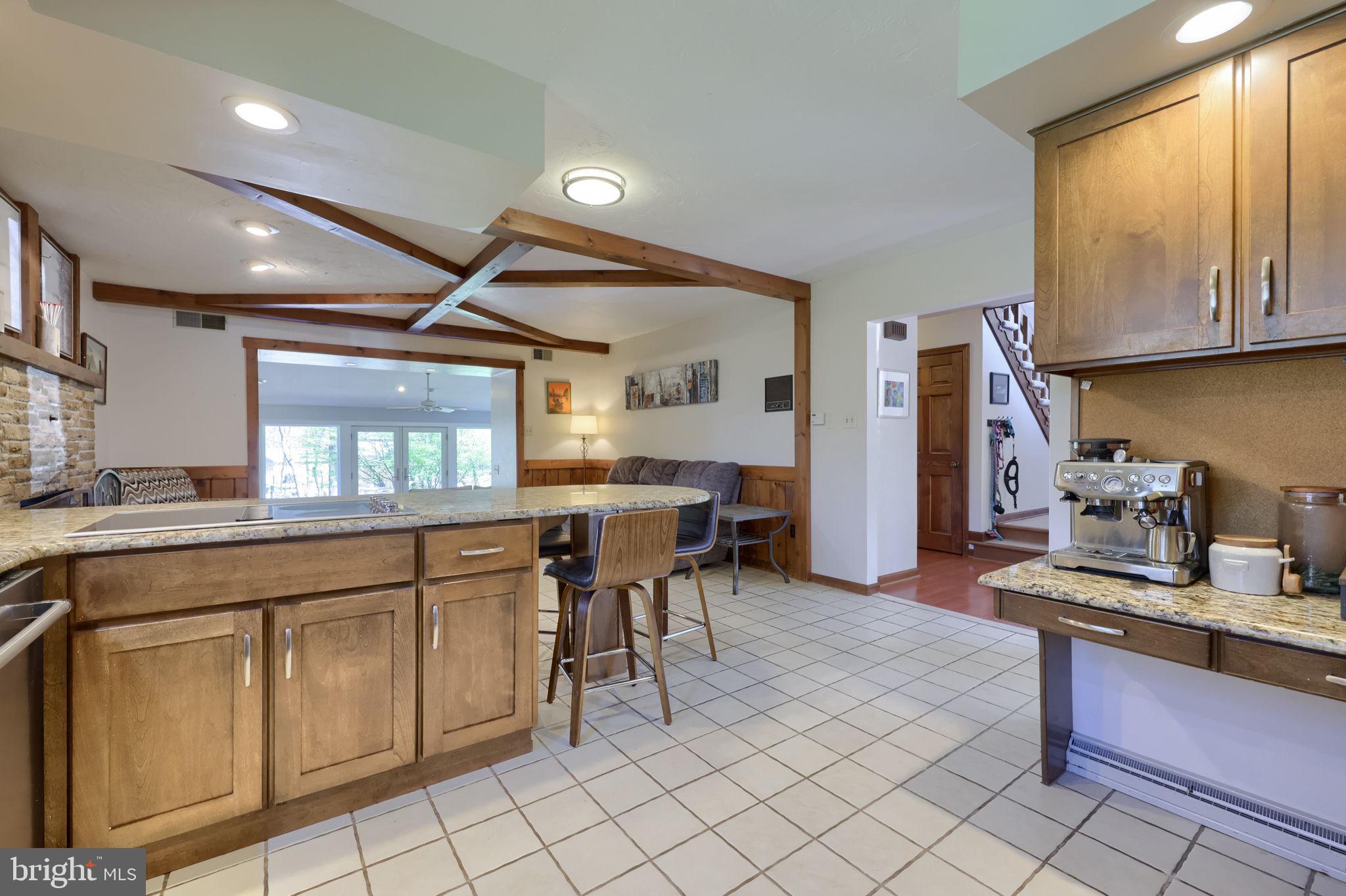 2211 Rocky Ridge Court York, PA 17406 - Photo 15 of 48 a kitchen with cabinets and chairs