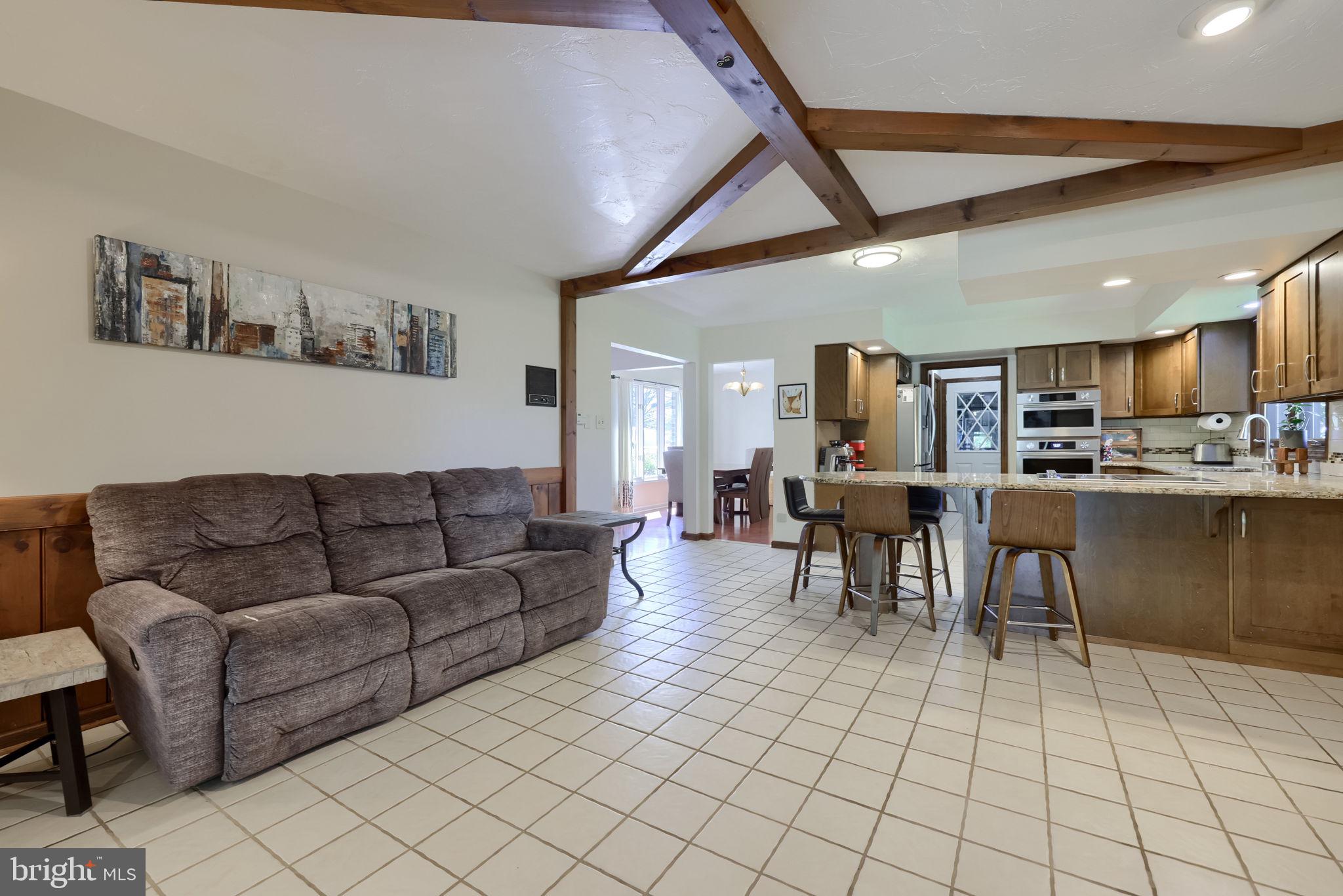 2211 Rocky Ridge Court York, PA 17406 - Photo 18 of 48 a living room with furniture and kitchen view