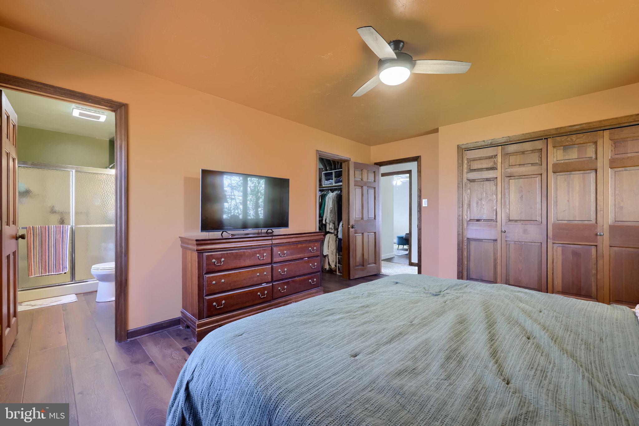 2211 Rocky Ridge Court York, PA 17406 - Photo 27 of 48 a bedroom with a bed and a chandelier