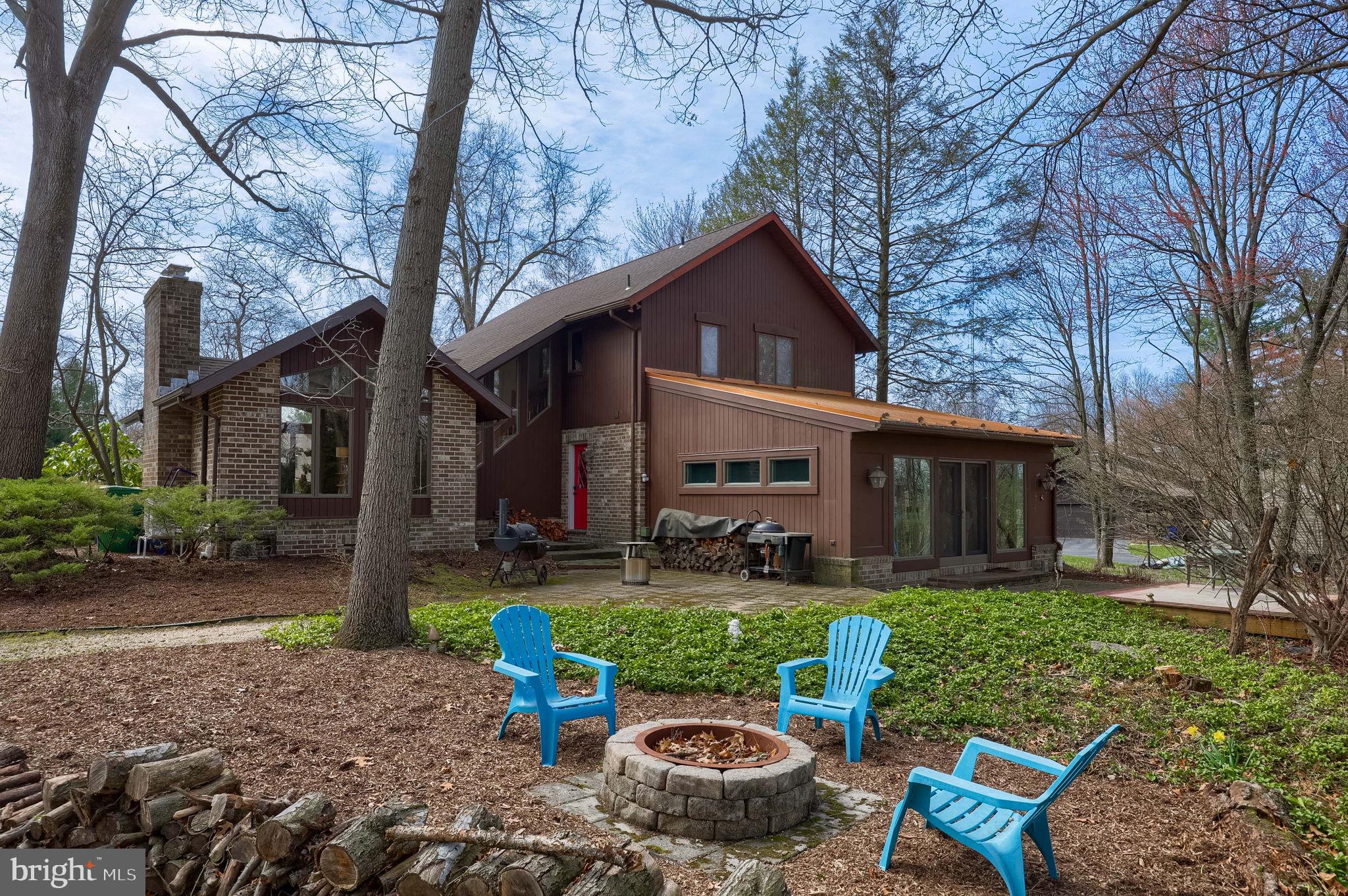 2211 Rocky Ridge Court York, PA 17406 - Photo 36 of 48 a view of a chair and table in backyard of the house