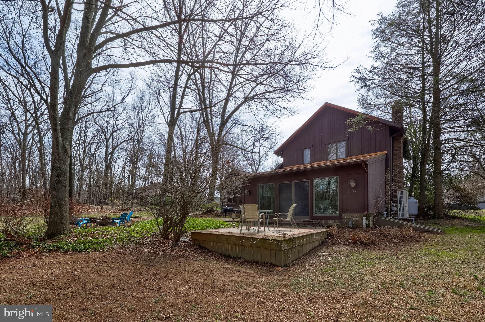 2211 Rocky Ridge Court York, PA 17406 - Photo 39 of 48 a front view of a house with garden and trees