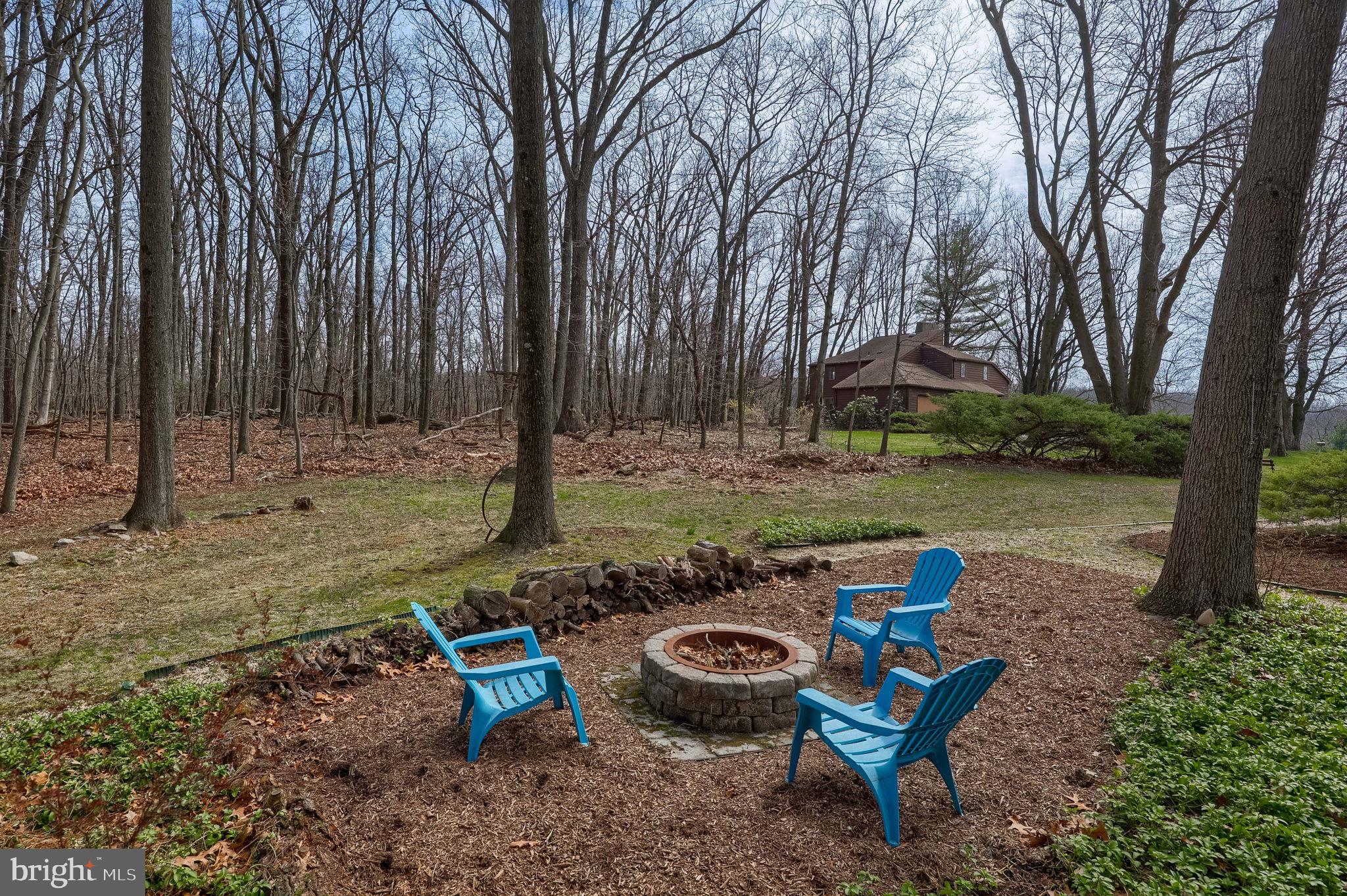 2211 Rocky Ridge Court York, PA 17406 - Photo 40 of 48 a view of a backyard with table and chairs under an umbrella