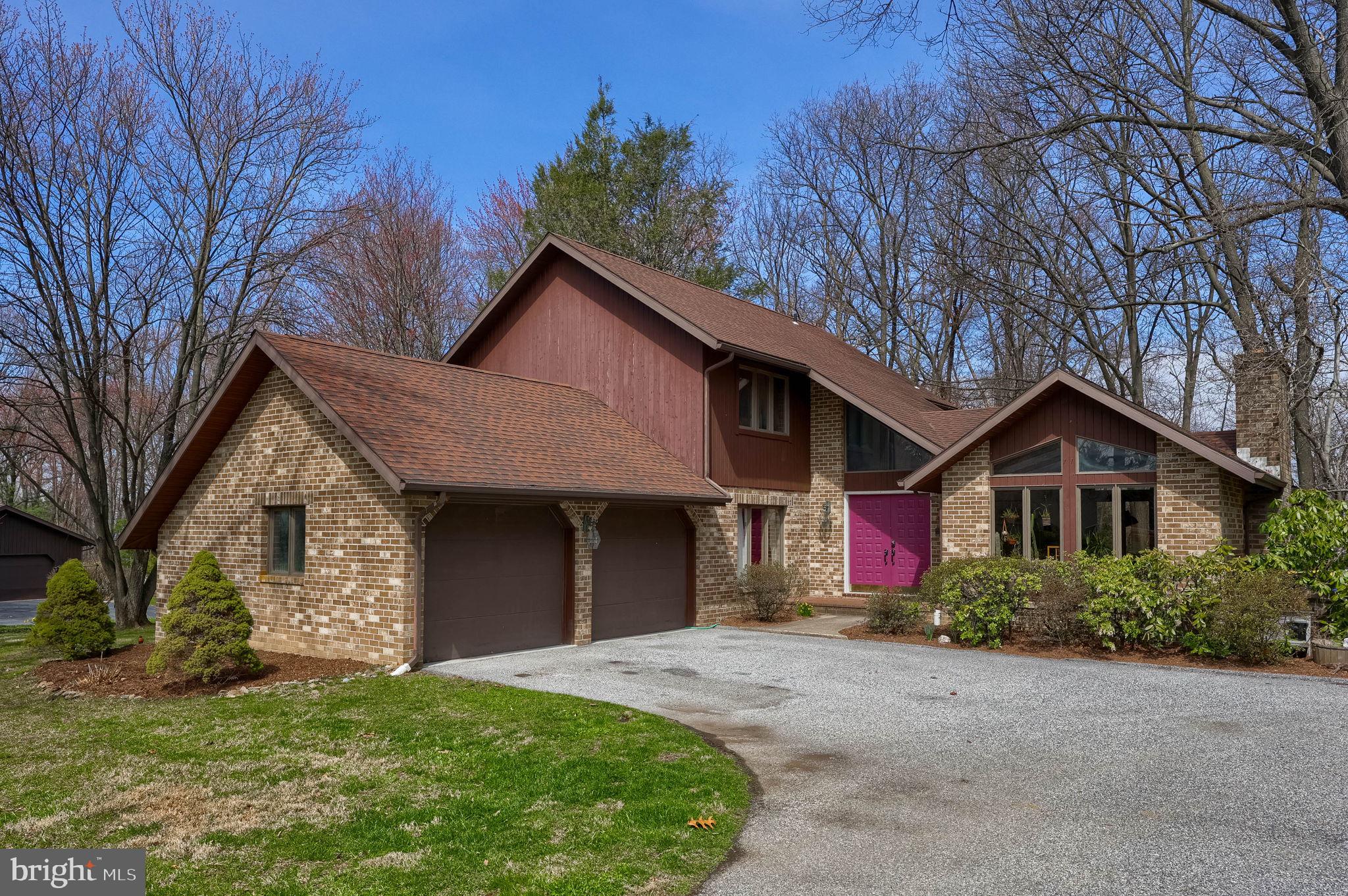 2211 Rocky Ridge Court York, PA 17406 - Photo 45 of 48 a front view of a house with a yard and garage