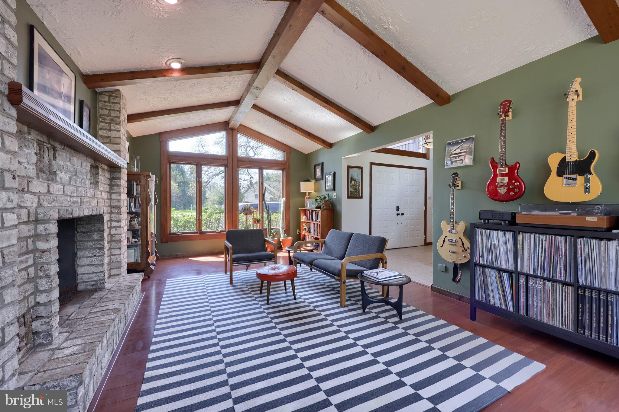 2211 Rocky Ridge Court York, PA 17406 - Photo 5 of 48 a living room with furniture a fireplace and a floor to ceiling window