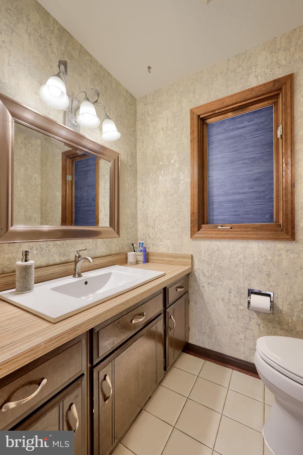 2211 Rocky Ridge Court York, PA 17406 - Photo 8 of 48 a bathroom with a toilet sink and mirror