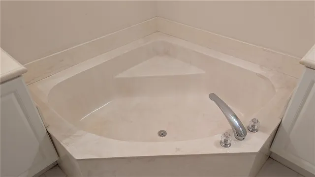 a bathroom with a white bath tub