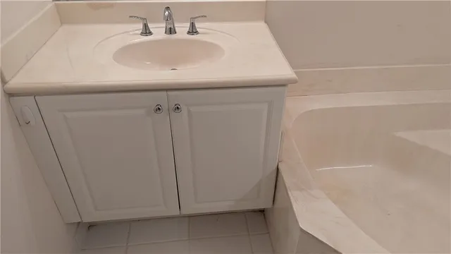 a bathroom with a sink and shower