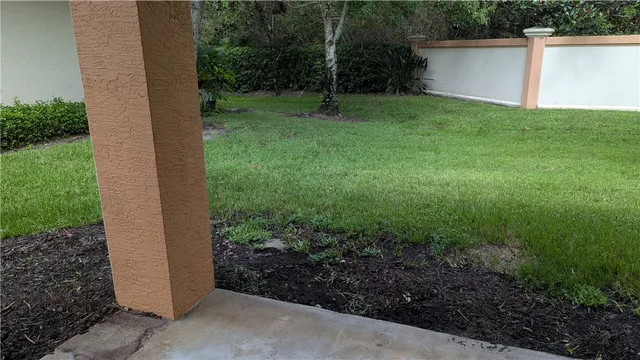 a backyard of a house with lots of green space