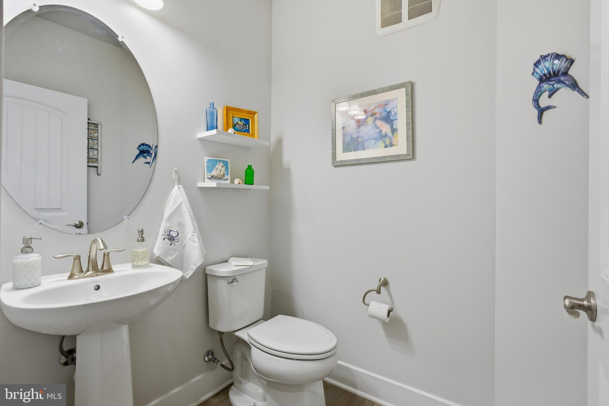 190 Harrier Way, Unit 24 Chester, MD 21619 - Photo 44 of 78 a bathroom with a toilet and a sink