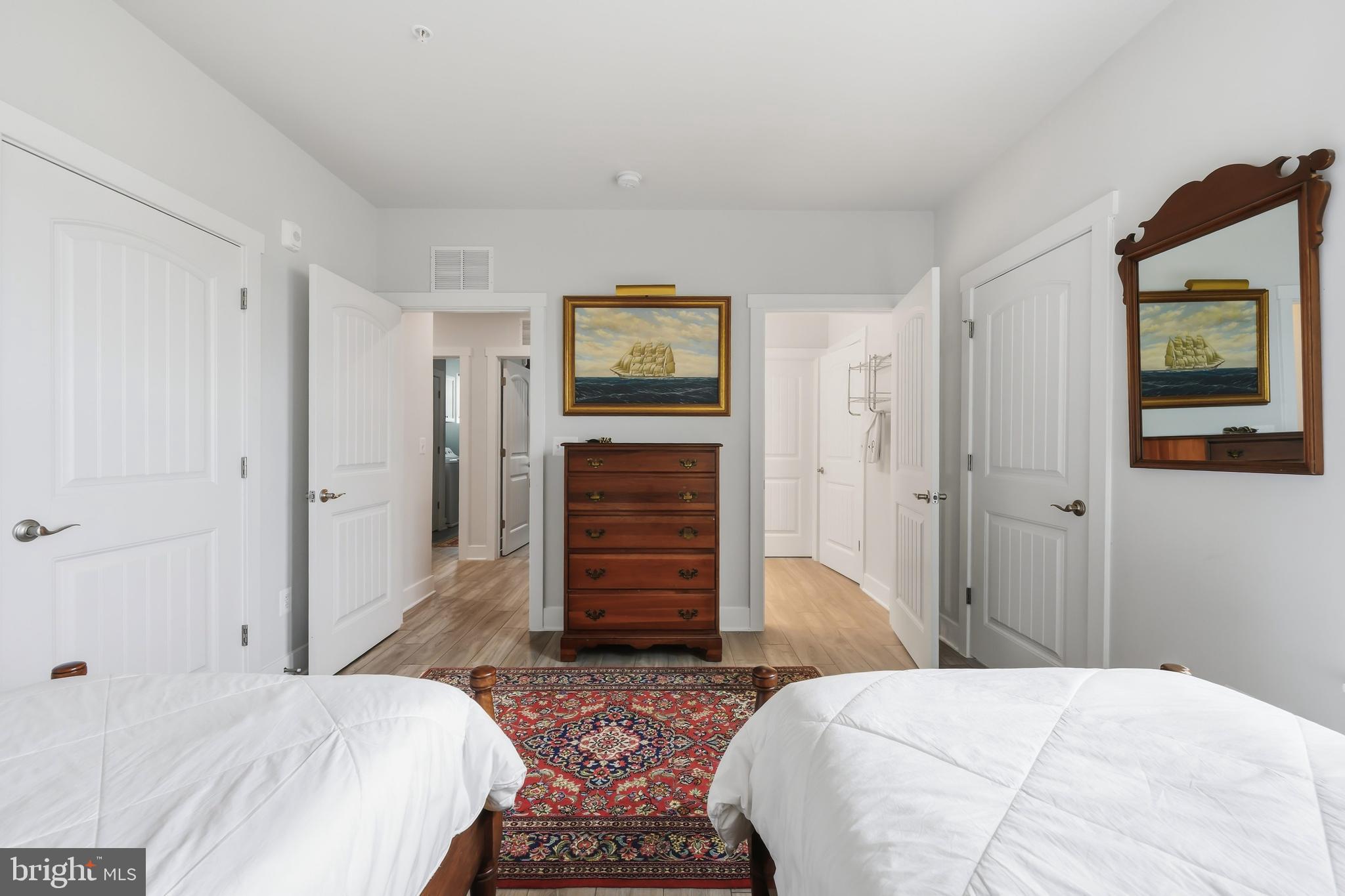 190 Harrier Way, Unit 24 Chester, MD 21619 - Photo 46 of 78 a bedroom with a bed and a walk in closet