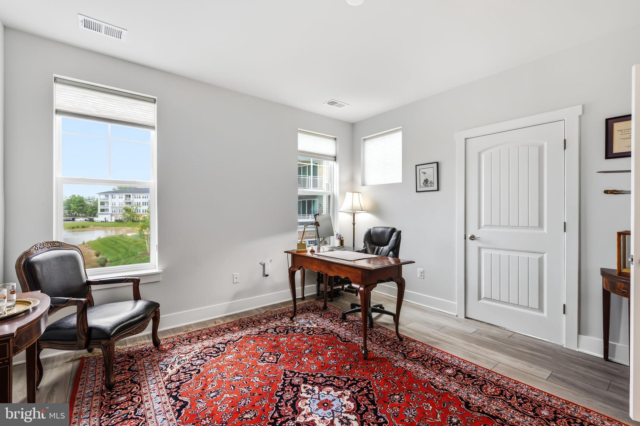 190 Harrier Way, Unit 24 Chester, MD 21619 - Photo 49 of 78 a workspace with wooden floor and a window