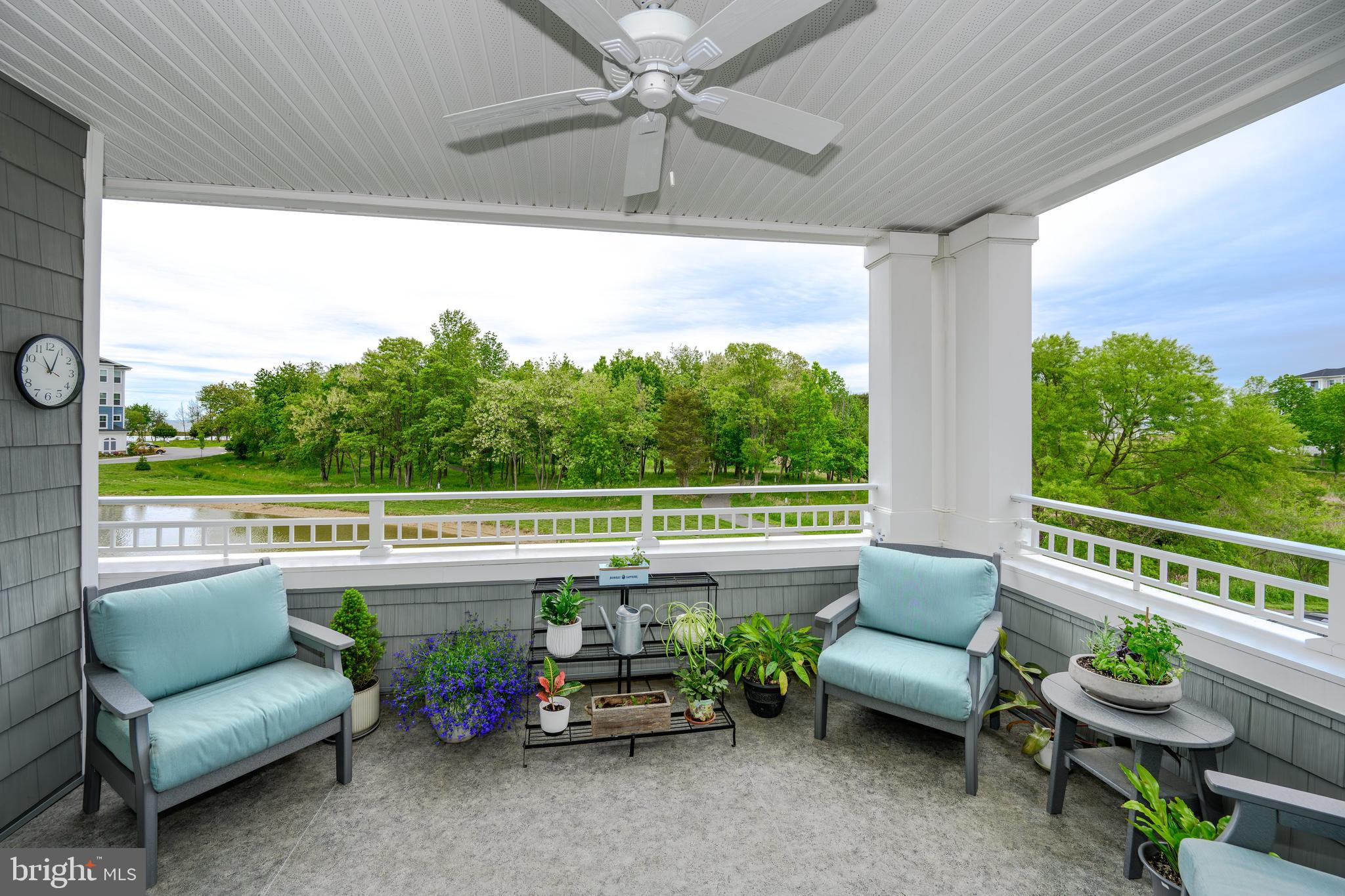 190 Harrier Way, Unit 24 Chester, MD 21619 - Photo 51 of 78 a outdoor living space with furniture and a garden